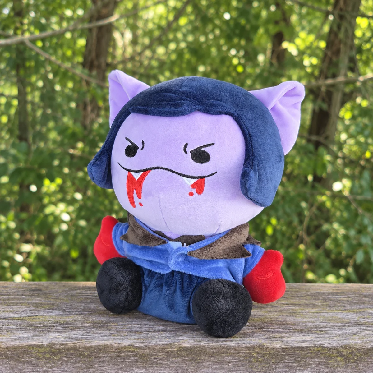 Mina Catlock plush sample in an edited woodland photograph